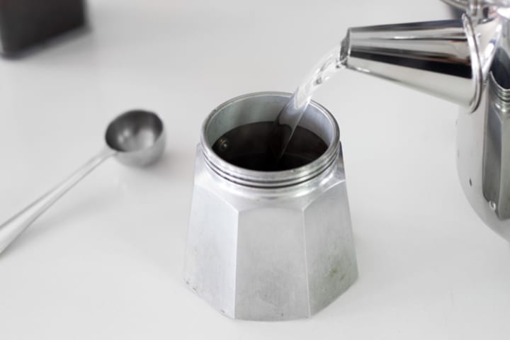 Filling moka pot base with hot water