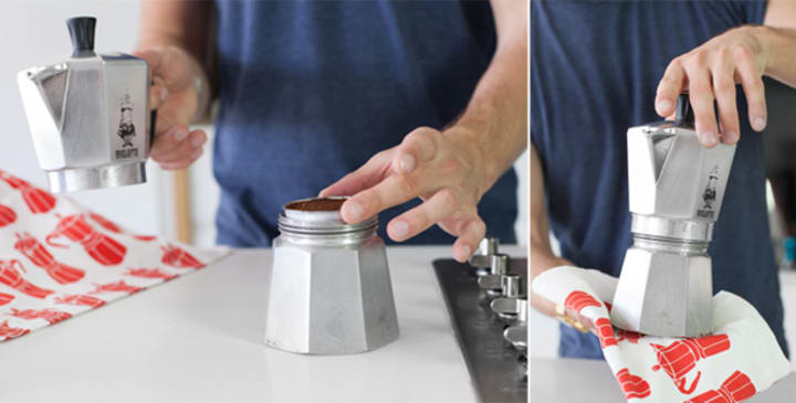 Inserting basket with coffee grinds into moka pot base