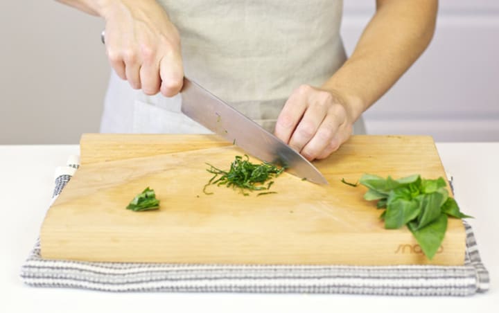 chopping basil with a chefs knife