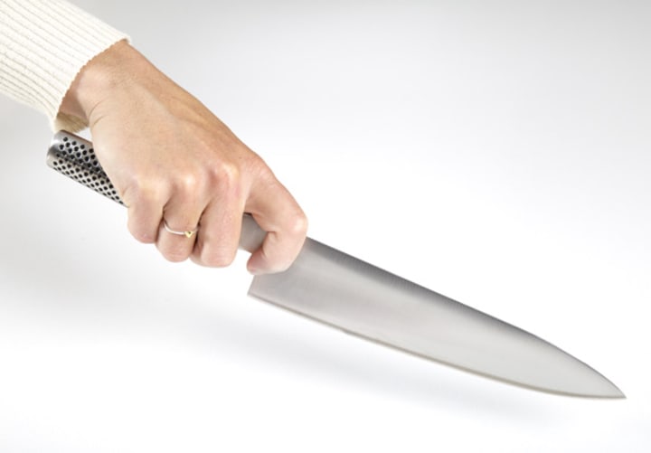 holding a chefs knife