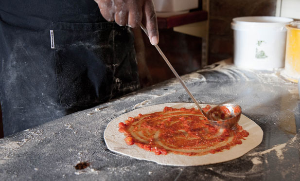 sauce ladle for tomato base on pizza