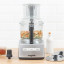 Magimix Compact 1100W Food Processor, 5200XL - Satin on the table