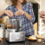 Magimix Compact 1100W Food Processor, 5200XL - Satin on the table