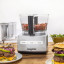 Magimix Compact 1100W Food Processor, 5200XL - Satin on the table