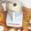 Magimix Compact 1100W Food Processor, 5200XL - White on the table