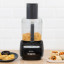 Magimix Le Mini Plus 1.7L Food Processor - Black on the table