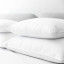 Royal Comfort Duck Down Pillow, 50% Down - Standard on the bed
