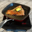 Snappy Chef Traveller 1200W Induction Cooker Plate with a pan and meat