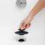 Umbra Flex Drain Cover - Black  in a bathtub 