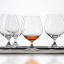 Spiegelau Lead-Free Crystal Vino Grande Cognac Glasses, Set of 4 on the table with whiskey in one glass