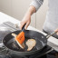 Joseph Joseph Turner Tongs being used in a pan flipping food