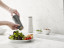 Joseph Joseph Milltop Salt and Pepper Mill Set In Use