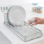 Brabantia Compact Dish Drying Rack light grey with plates and glasses