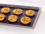 NoStik Reusable Baking Liner, on tray with pastries