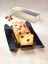 NoStik Reusable Cake Tin Liner, Rectangular with cake out of loaf tin