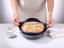 NoStik Reusable Cake Tin Liner, Round, lifting cake from tin