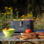Everdure by Heston Blumenthal Cube Charcoal Portable Braai with meat on the table