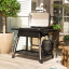 Everdure by Heston Blumenthal Furnace 3 Burner Gas Braai with Stand opened on the patio