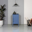 Popstrukt Sugar Cube Side Table - Pigeon Blue next to the bed
