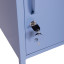 Popstrukt Sugar Cube Side Table - Pigeon Blue next to the bed
