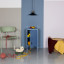 Popstrukt Sugar Cube Side Table - Pigeon Blue next to the bed