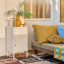 Popstrukt Sugar Cube Side Table - Soft White next to a couch