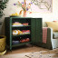 Popstrukt Sugar Cube Storage Cabinet - Dark Olive with towels and throws
