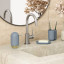 Umbra Touch Soap Dish - Slate Blue next to a tap by the basin 