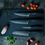 Performer range on chopping board with vegetables. Additional knives sold separately