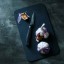 WÃ¼sthof Performer Paring Knife, 9cm on a chopping board next to garlic