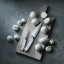 WuÌˆsthof CLASSIC WHITE Cooks Knife, 16cm on a chopping board next to vegetables 