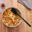 Tovolo Flex-Core All Silicone Spoonula - Black with bowl of pasta