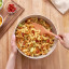 Tovolo Flex-Core All Silicone Spoonula - Apricot with bowl of pasta