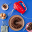 Smeg Retro Style Hand Mixer - Fiery red in use 