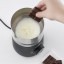 Severin Spuma 500 Induction Milk Frother in use with chocolate block