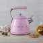 Smeg Whistling Stovetop Kettle - Pastel Pink in use