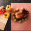 Bryco Pink Butcher Paper Roll, 53m - 45cm Wide on the table with full chicken and other ingredients