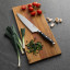 Sagenwolf Performance Chef's Knife, 21cm on a wooden board with sliced chives 