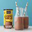 NOMU Reduced Sugar Chocmilk on the table with two bottles