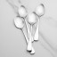Yuppiechef Classic Dessert Spoon, Set of 4 on the table