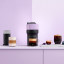 Nespresso Vertuo Pop Coffee Machine - Lilac on the table with coffee
