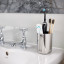 Joseph Joseph EasyStore Luxe Toothbrush Caddy on sink with toothbrushes and toothpaste 