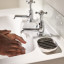 Joseph Joseph EasyStore Luxe Quick Drain Soap Dish with someone washing their hands