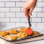 Dreamfarm Mini Chopula Spatula - Red lifting the cookie