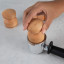 Oh Nice Wooden Coffee Tamper, 58mm - Beech with a portafilter