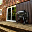 Traeger Ironwood 650 Wood Pellet Grill next to the door