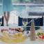 ShooAway Bamboo Fly Repellent Fan on the table with food
