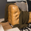Thread Office Knitted Cotton Throw - Olive on the couch