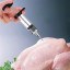 Creative Cooking Flavour Injector with a full chicken