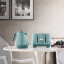 DeLonghi Ballerina Cordless Kettle, 1.7L - Laguna Green with a toaster on the table